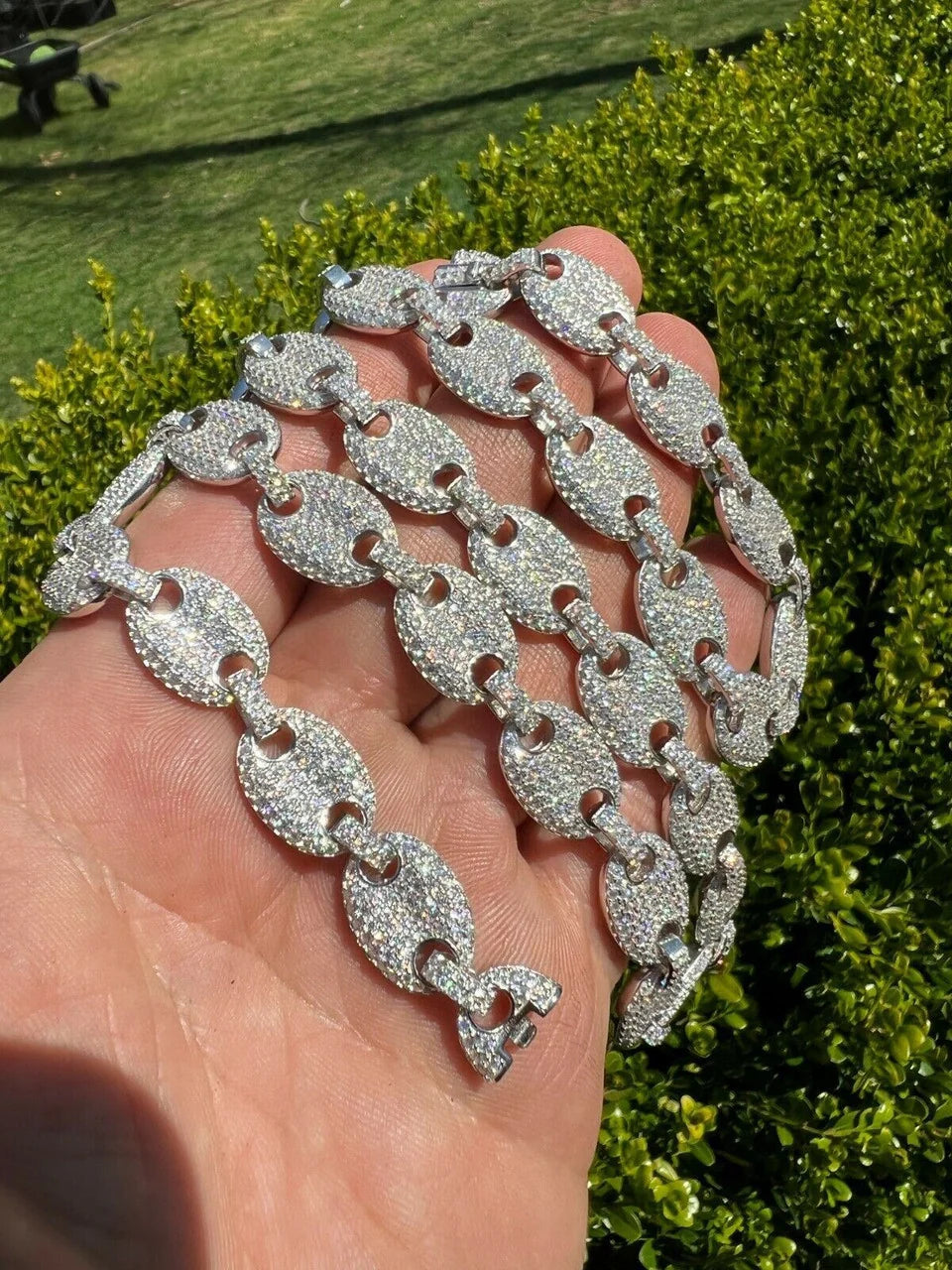 Custom iced out Gucci link chain shown in natural light