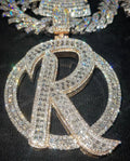 Custom interlocking initial medallion pendant with baguette and round VVS stones