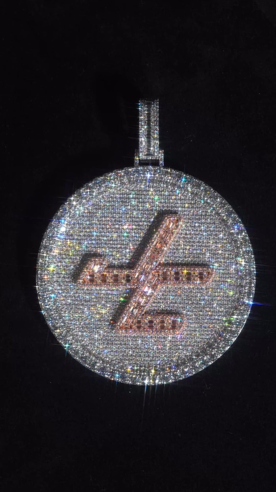 Custom pavé logo disc pendant with contrasting baguette stone detailing