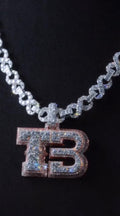 Custom stacked initial pendant with a dual-tone VVS stone finish