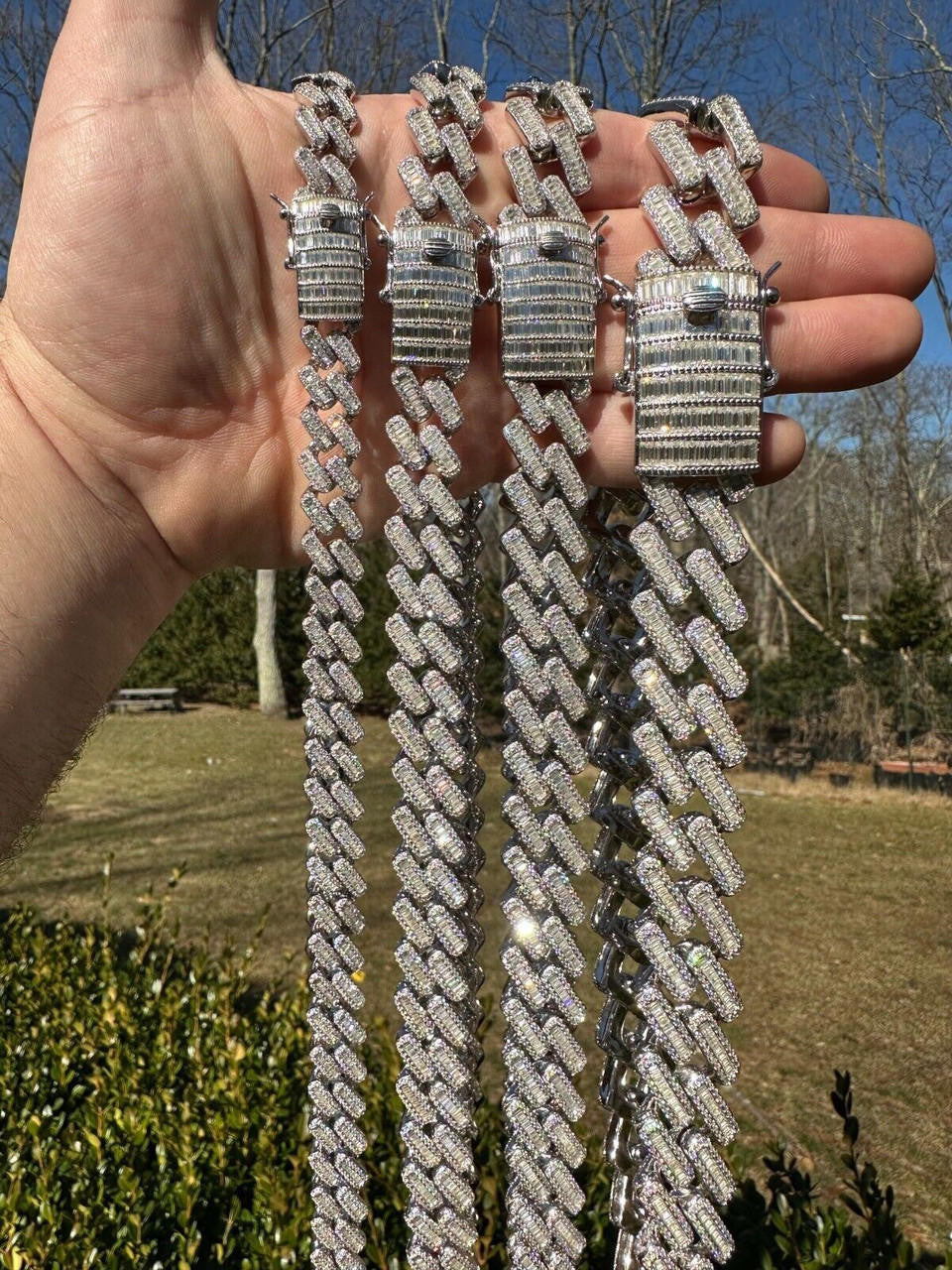 Iced out Cuban link chain with baguette stones and pavé detailing