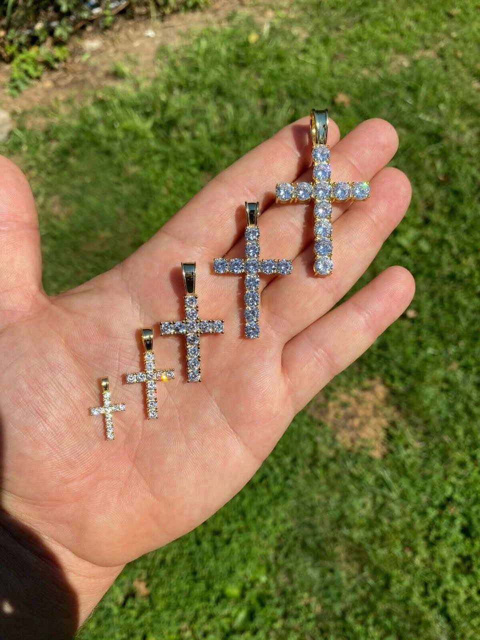 Iced out Jesus cross pendants shown in multiple sizes