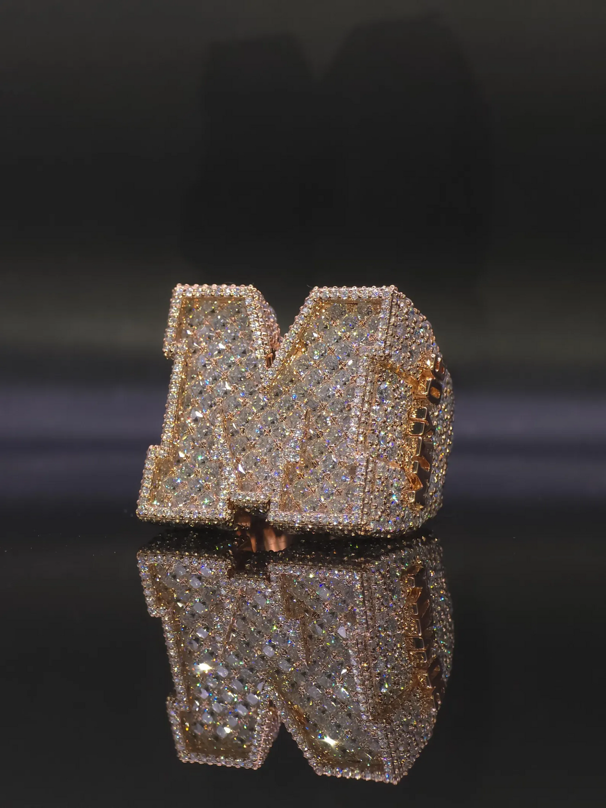 Custom oversized initial ring with crushed-ice stone setting
